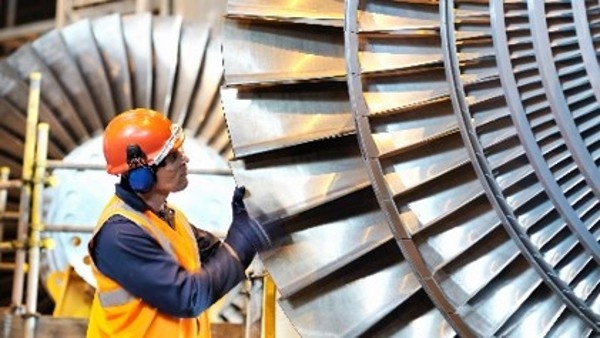 Learn about Varnish Man looking at turbine