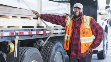 Man standing by truck Man standing by truck