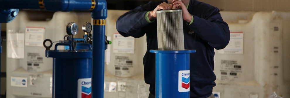 Oil cleanliness: It’s more than filtering to a micron level Man changing filter