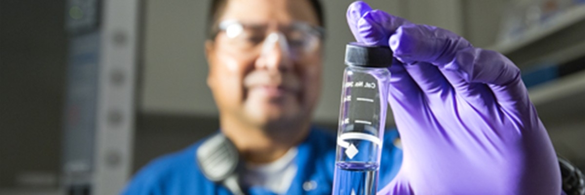 LubeWatch Man inspecting glass tube