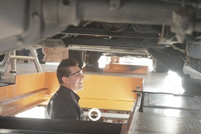 man changing oil