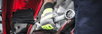 How to build a modern maintenance shop for small and medium-size fleets Man Holding Wrench