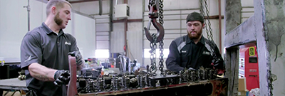 Hoge Motor’s Mack MP 8 engine Mechanics working in shop