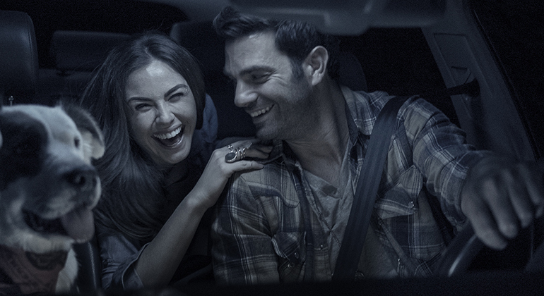 Couple with dog in car