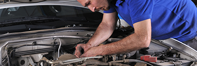 Mechanic working on engine Mechanic working on engine
