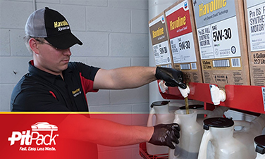 Pitpack features Man pouring oil from pitpack rack