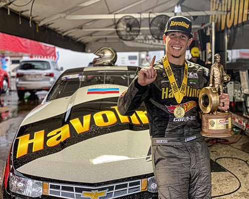 Alex Laughlin with Havoline car Alex Laughlin with Havoline car