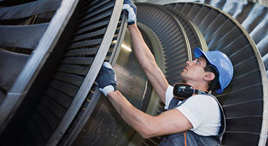 Full line of GST products man inspecting turbines