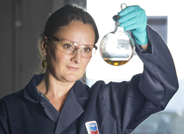 woman holding beaker